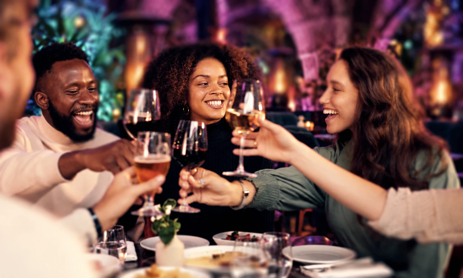 Friends celebrating together with a toast in the Garden